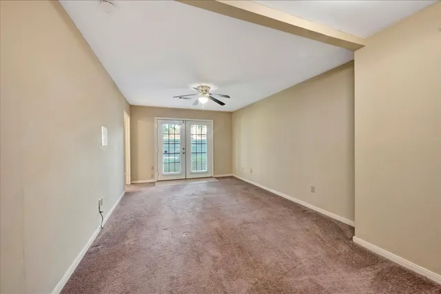 a view of a livingroom with a ceiling fan