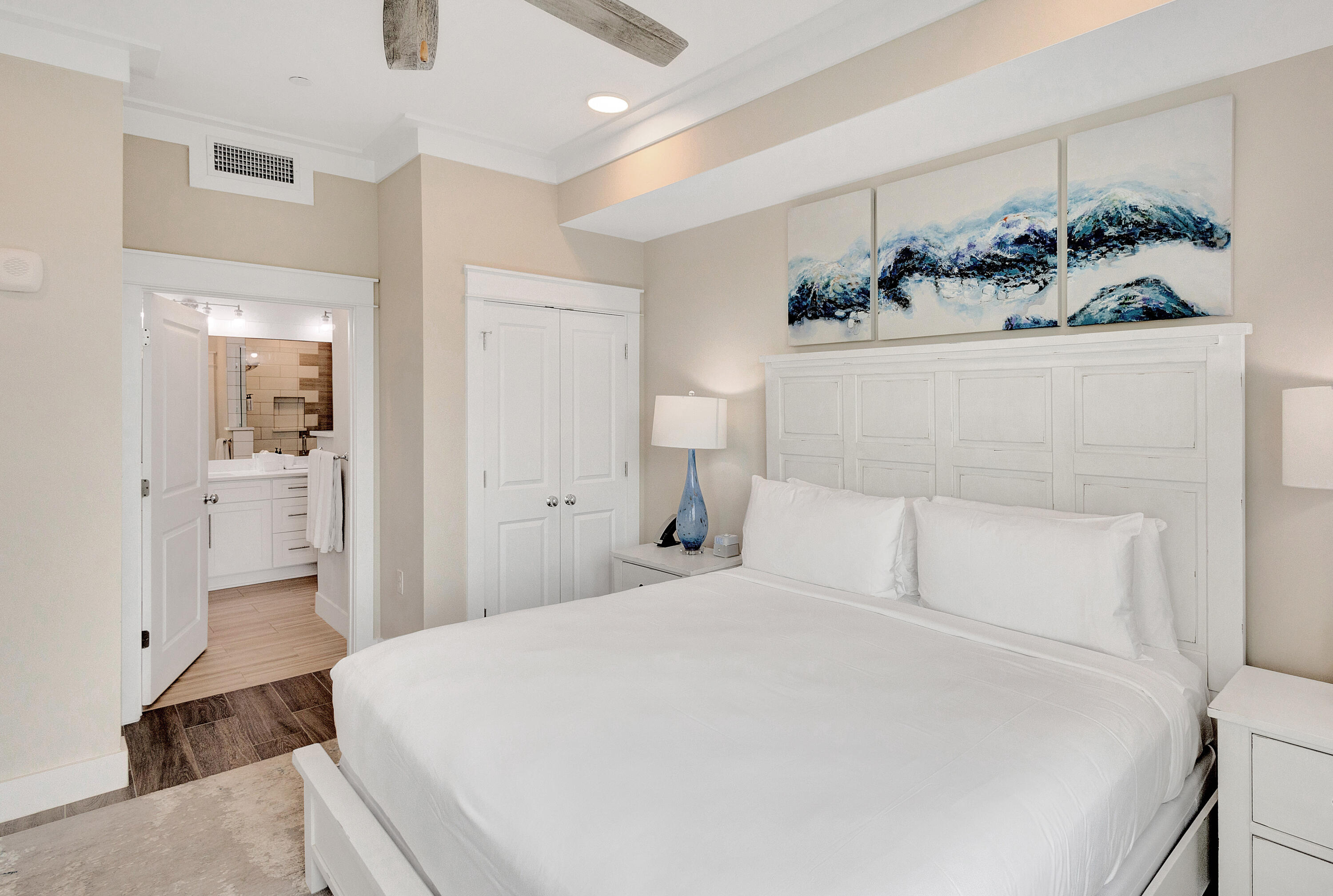 204 Henderson Resort Way, Unit 3104 Destin, FL 32541 - Photo 25 of 37 a bedroom with a bed and a view of bathroom