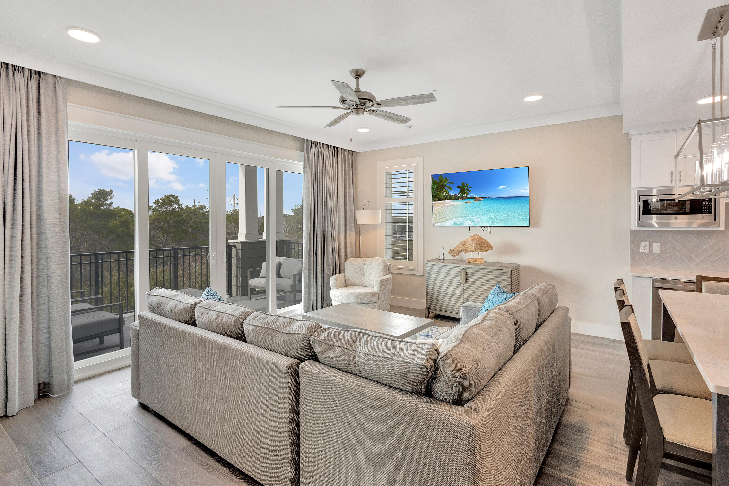 204 Henderson Resort Way, Unit 3104 Destin, FL 32541 - Photo 7 of 37 a living room with furniture and a large window