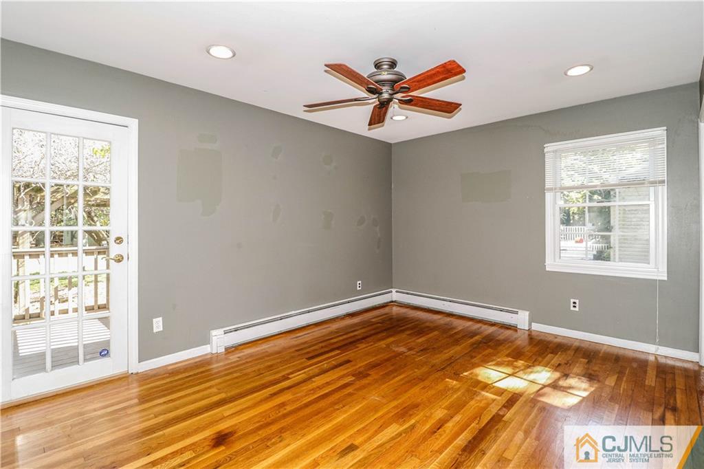 860 Grove Avenue Edison, NJ 08820 - Photo 13 of 22 a view of a room with wooden floor and fan