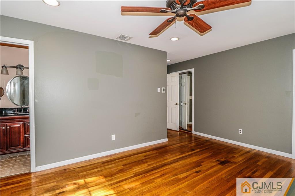 860 Grove Avenue Edison, NJ 08820 - Photo 14 of 22 a view of a room with wooden floor and ceiling fan