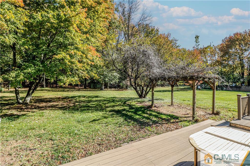 860 Grove Avenue Edison, NJ 08820 - Photo 18 of 22 a view of a garden with a deck