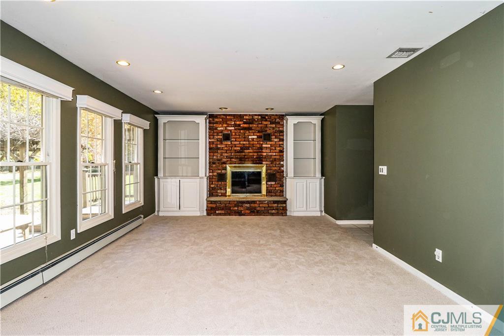 860 Grove Avenue Edison, NJ 08820 - Photo 8 of 22 a view of an empty room with a window and kitchen view
