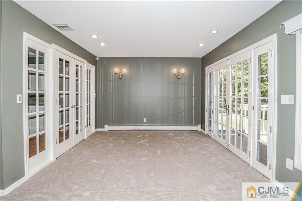 860 Grove Avenue Edison, NJ 08820 - Photo 9 of 22 a view of an empty room with a window