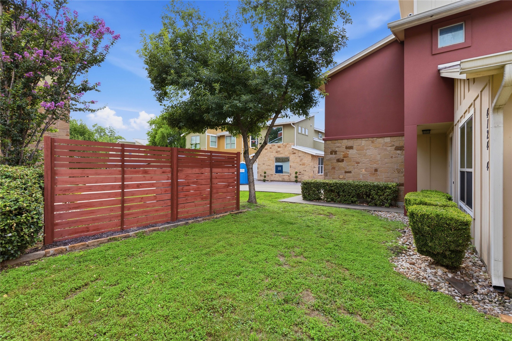 4124 Valley View Road, Unit 4A & 4B Austin, TX 78704 - Photo 3 of 40 A well-maintained lawn and sturdy wood fence create a private, inviting outdoor space.