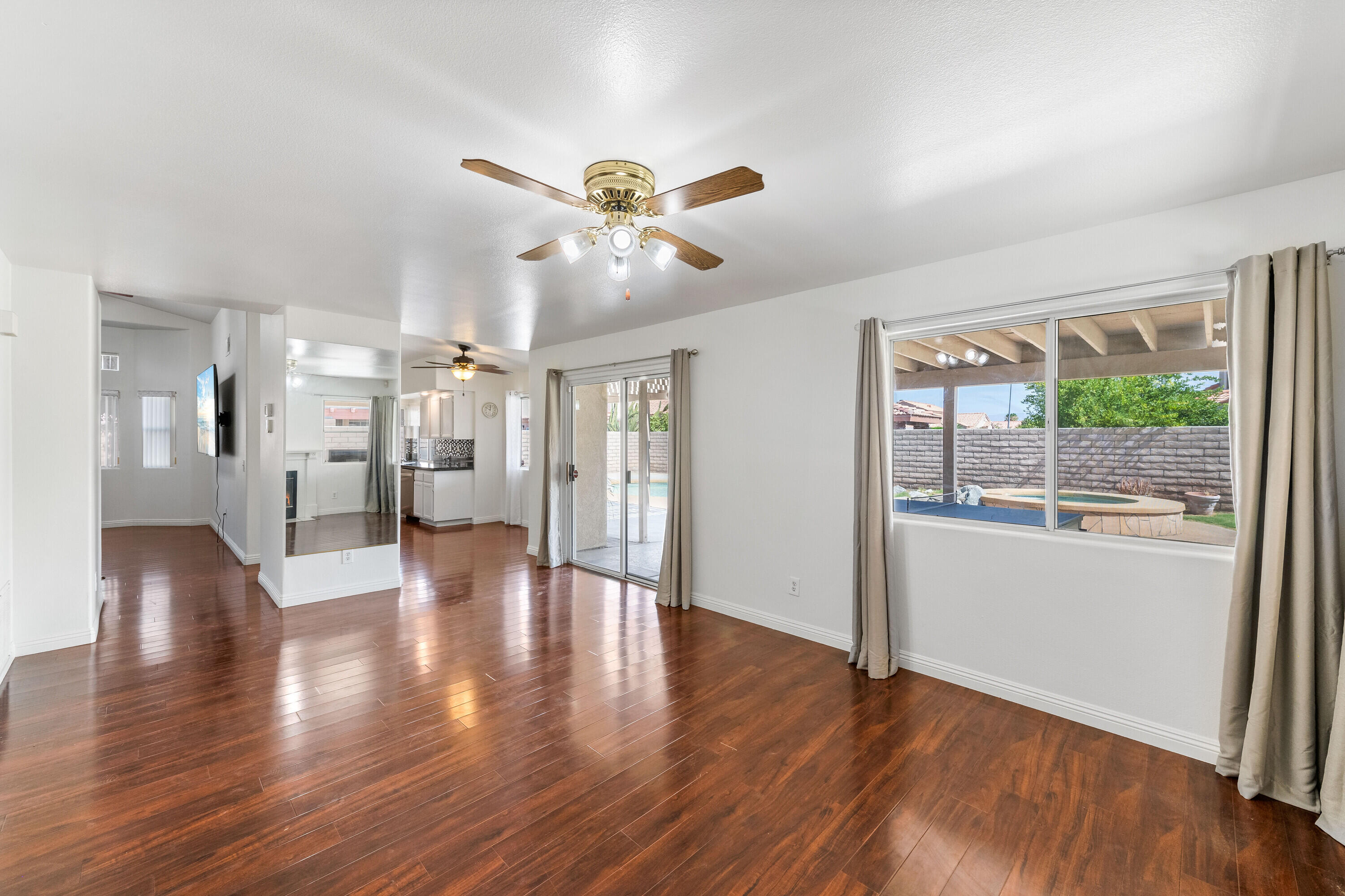 80366 Paseo Encanto Indio, CA 92201 - Photo 15 of 48 a view of an empty room with wooden floor and a window