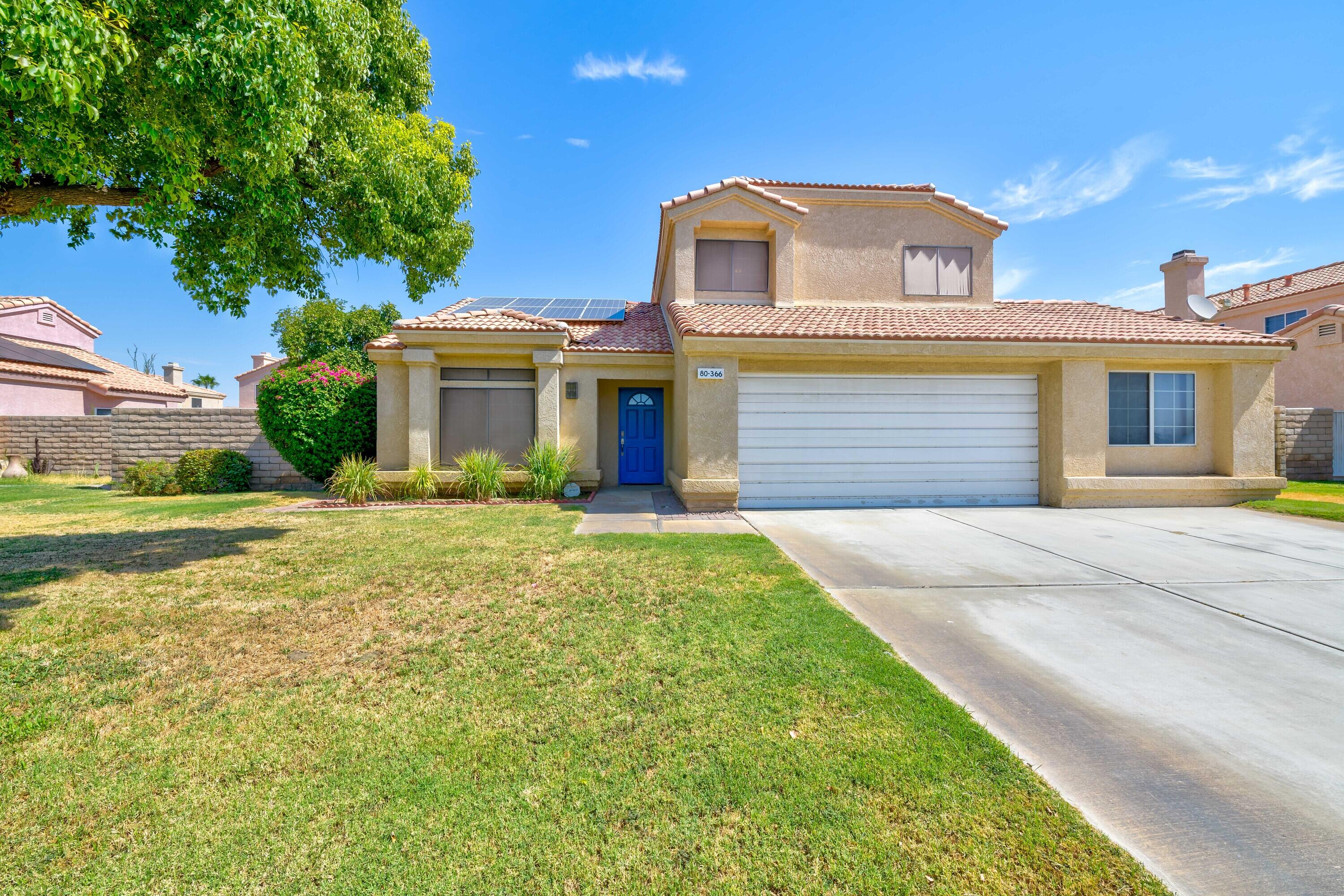80366 Paseo Encanto Indio, CA 92201 - Photo 2 of 48 a front view of a house with garden