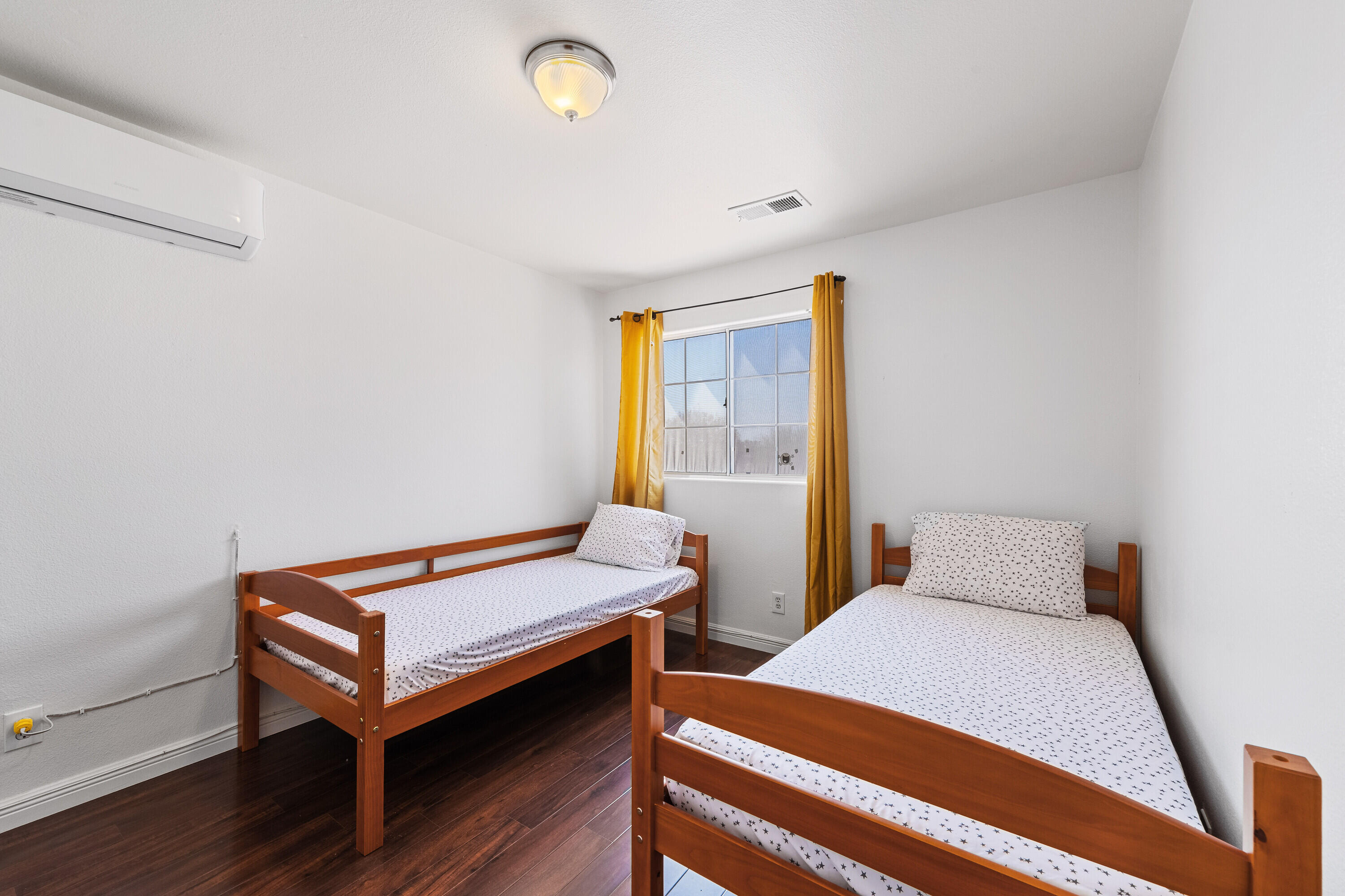 80366 Paseo Encanto Indio, CA 92201 - Photo 23 of 48 a bedroom with a bed and wooden floor