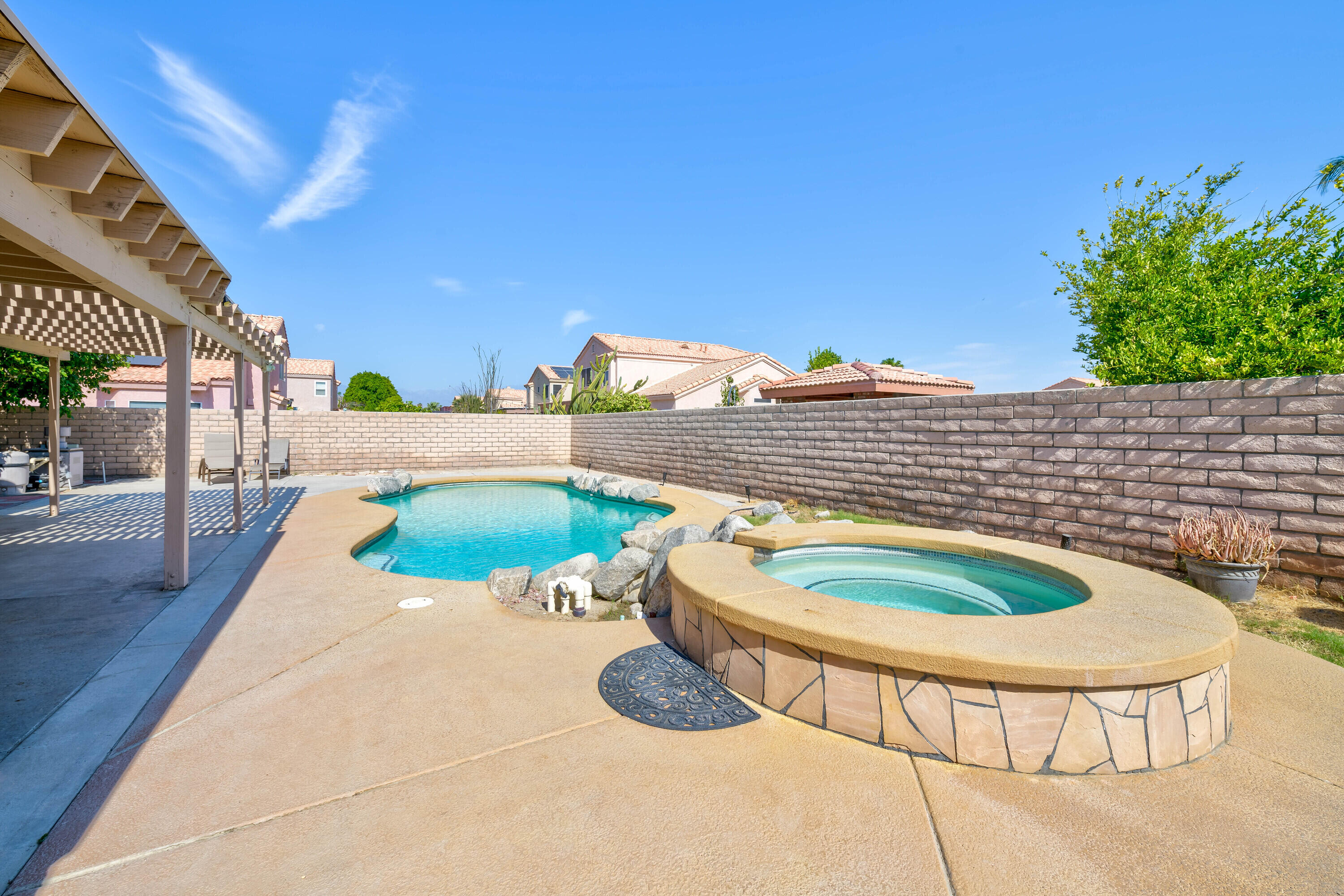 80366 Paseo Encanto Indio, CA 92201 - Photo 30 of 48 a white and red sitting area in front of the house