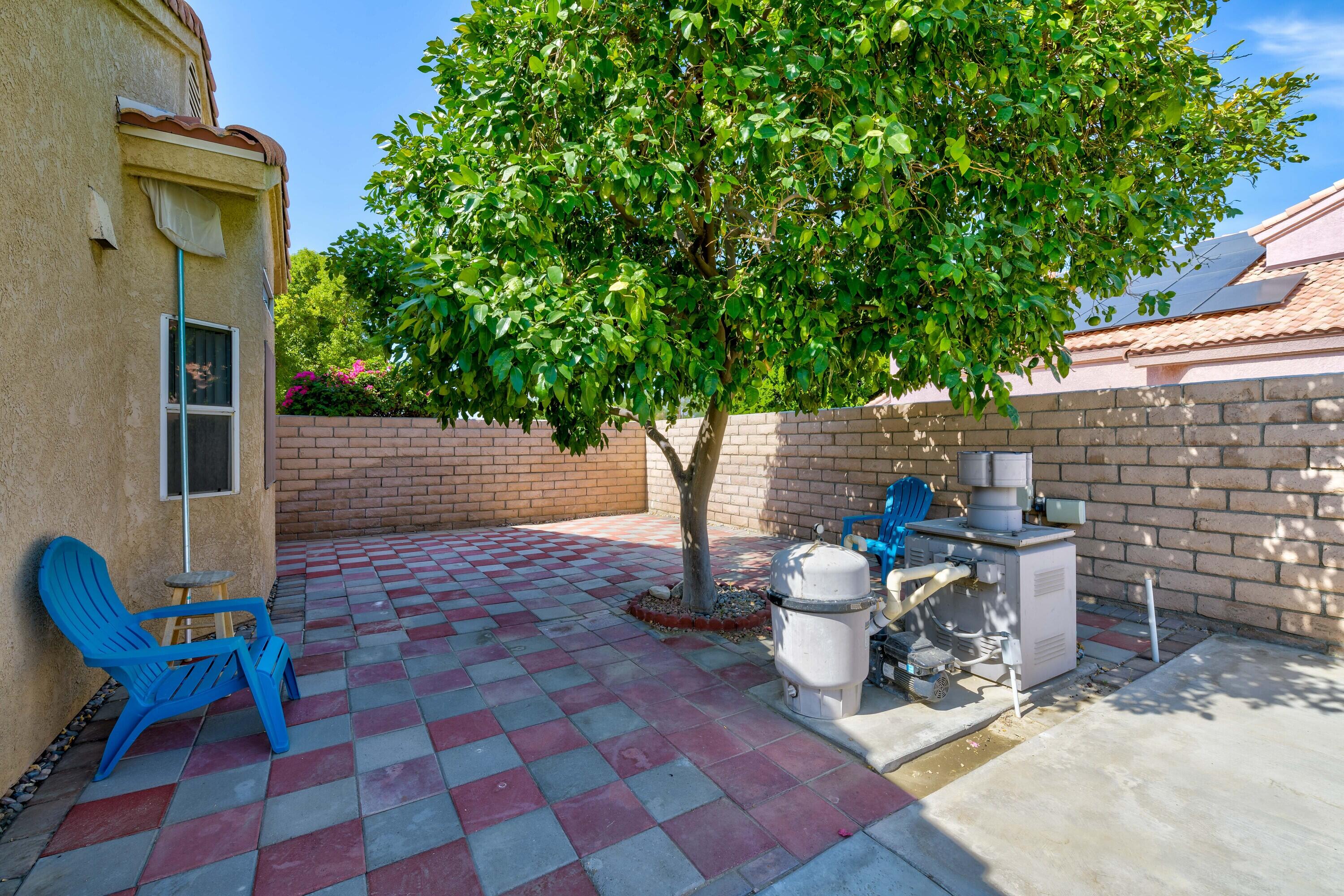80366 Paseo Encanto Indio, CA 92201 - Photo 32 of 48 a view of a chairs and table in the patio