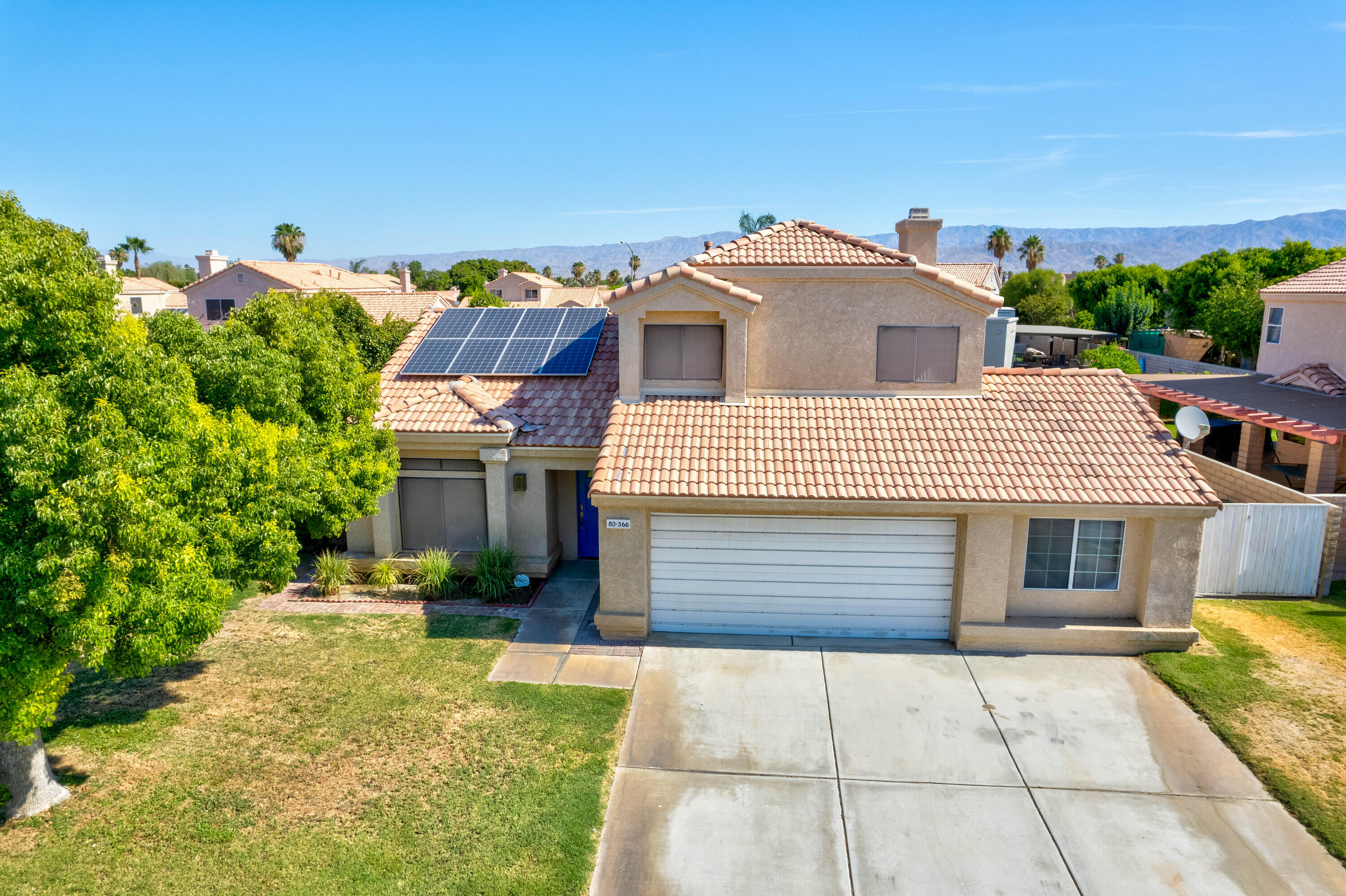 80366 Paseo Encanto Indio, CA 92201 - Photo 35 of 48 a front view of a house with a yard