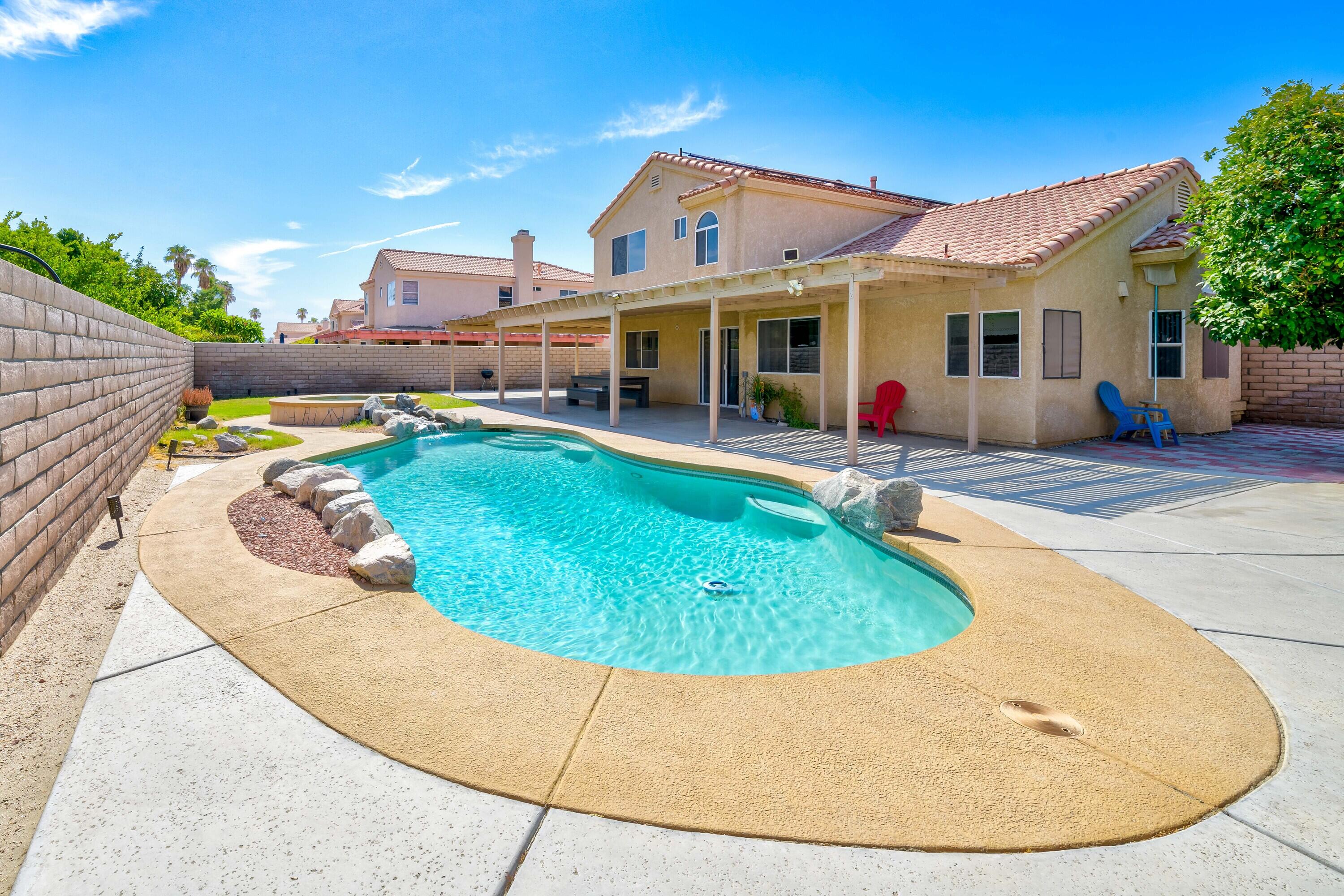 80366 Paseo Encanto Indio, CA 92201 - Photo 4 of 48 a view of a house with swimming pool
