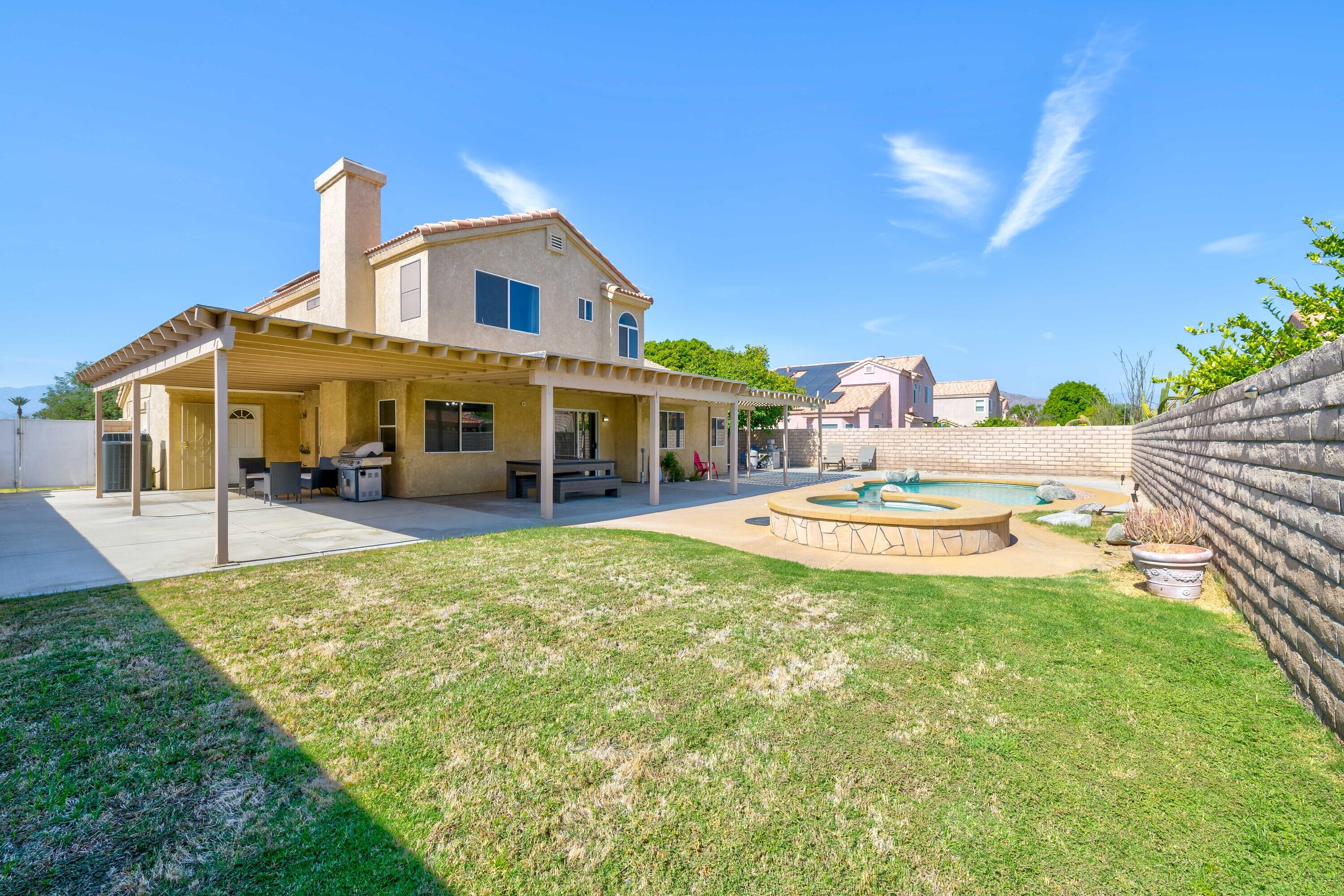 80366 Paseo Encanto Indio, CA 92201 - Photo 48 of 48 a view of a house with a backyard porch and a patio
