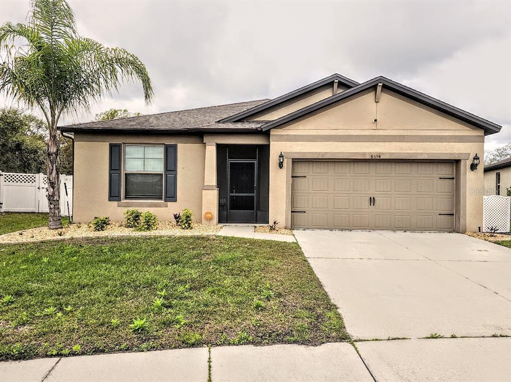 8594 Rindge Road Polk City, FL 33868 - Photo 2 of 16 a front view of house with yard