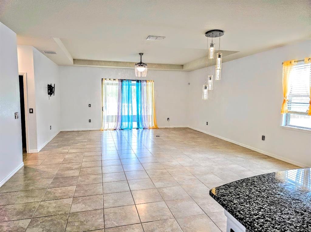 8594 Rindge Road Polk City, FL 33868 - Photo 5 of 16 a view of an empty room with a window