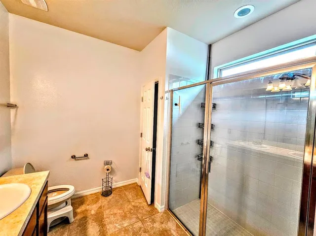 a bathroom with a tub and shower
