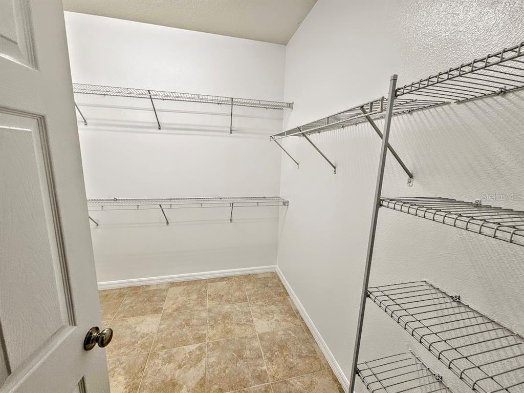8594 Rindge Road Polk City, FL 33868 - Photo 9 of 16 a view of a room with racks on the wall