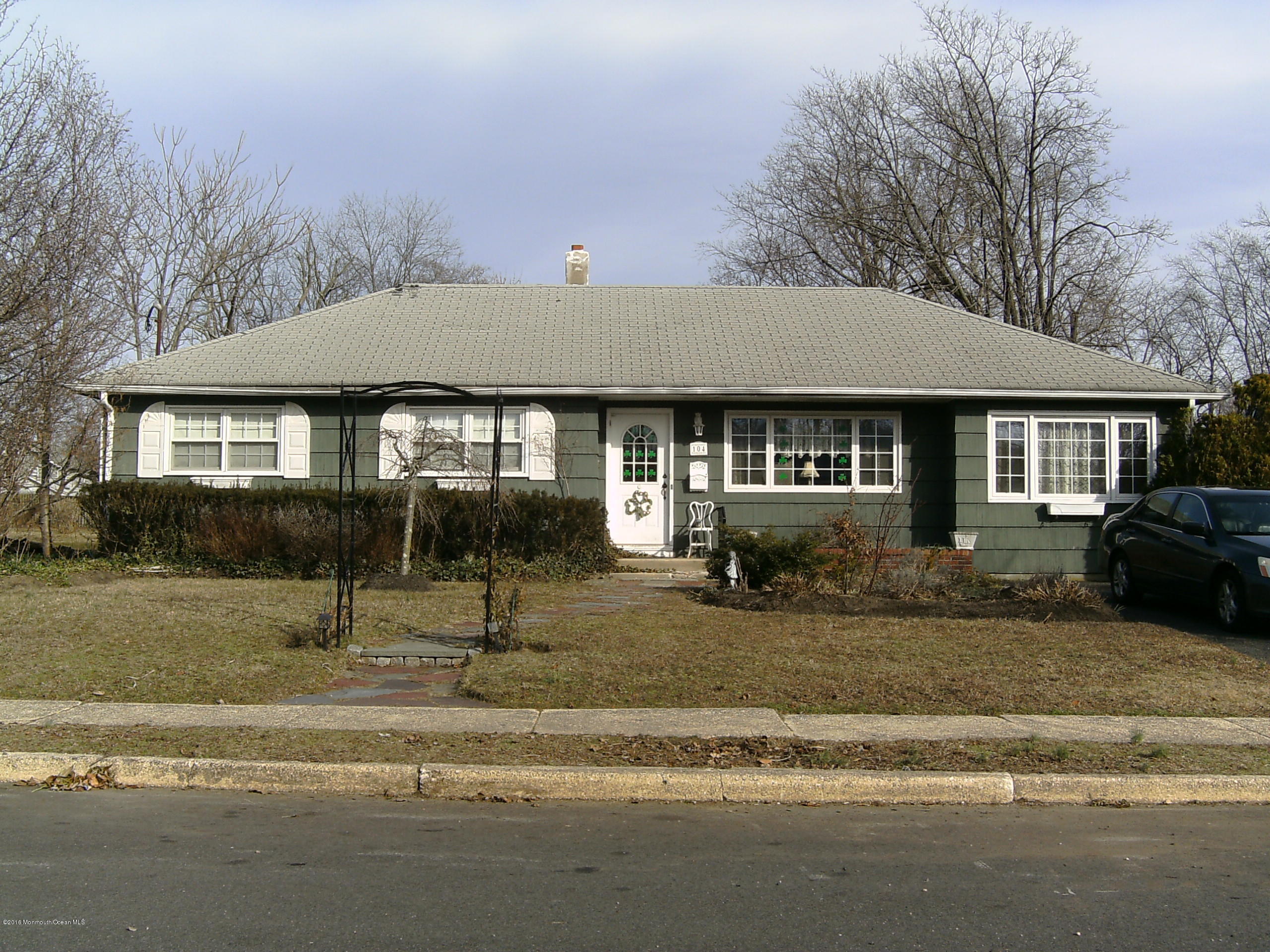104 Meadowbrook Road Spring Lake Heights, NJ 07762 - Photo 3 of 22 a front view of a house with a garden
