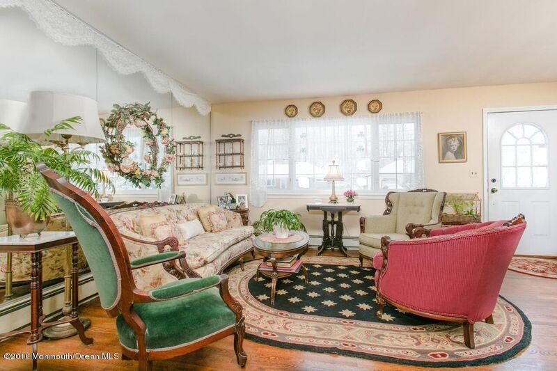 104 Meadowbrook Road Spring Lake Heights, NJ 07762 - Photo 4 of 22 a living room with furniture and a large window