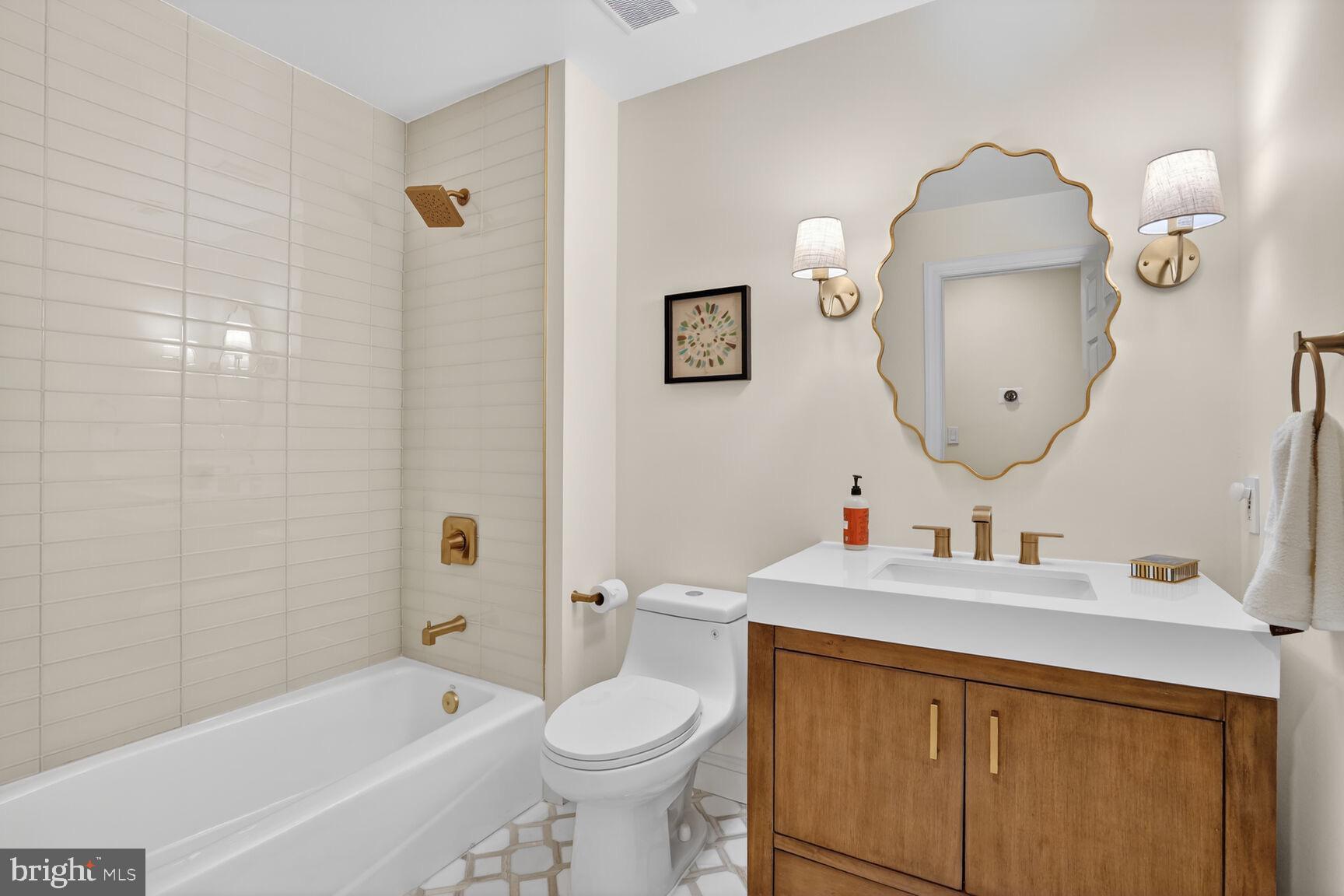 4837 W Street Northwest Washington, DC 20007 - Photo 38 of 51 a bathroom with a sink toilet and a bathtub