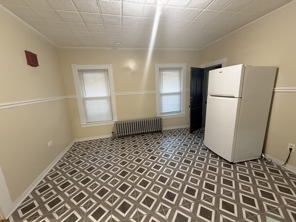 32 Manchester Street, Unit 1 Lowell, MA 01852 - Photo 5 of 8 a bathroom with a sink and a mirror