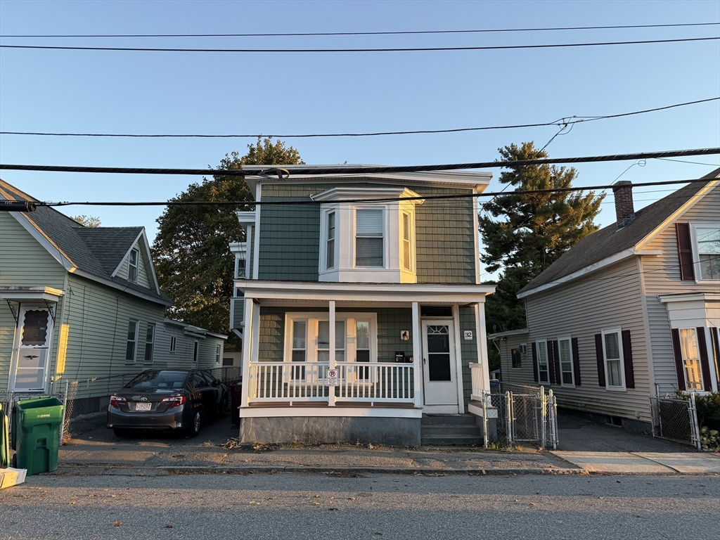 32 Manchester Street, Unit 1 Lowell, MA 01852 - Photo 8 of 8 a black car parked in front of a building