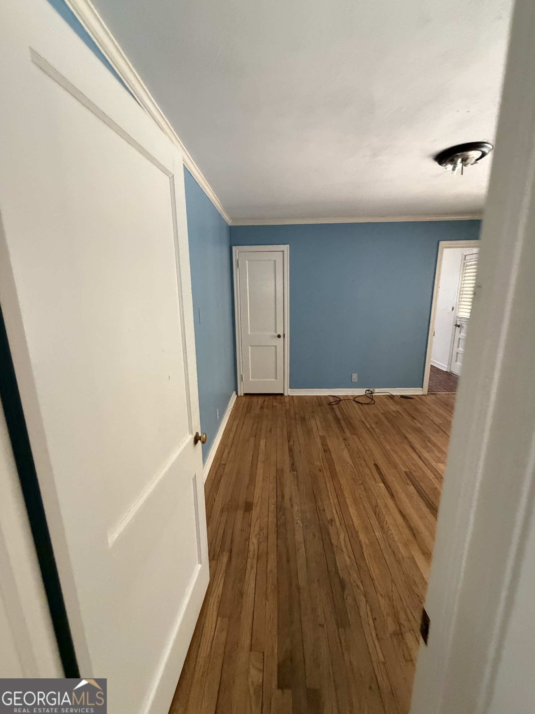 2006 Stonewall Street Dublin, GA 31021 - Photo 11 of 12 a view of a big room with wooden floor and staircase