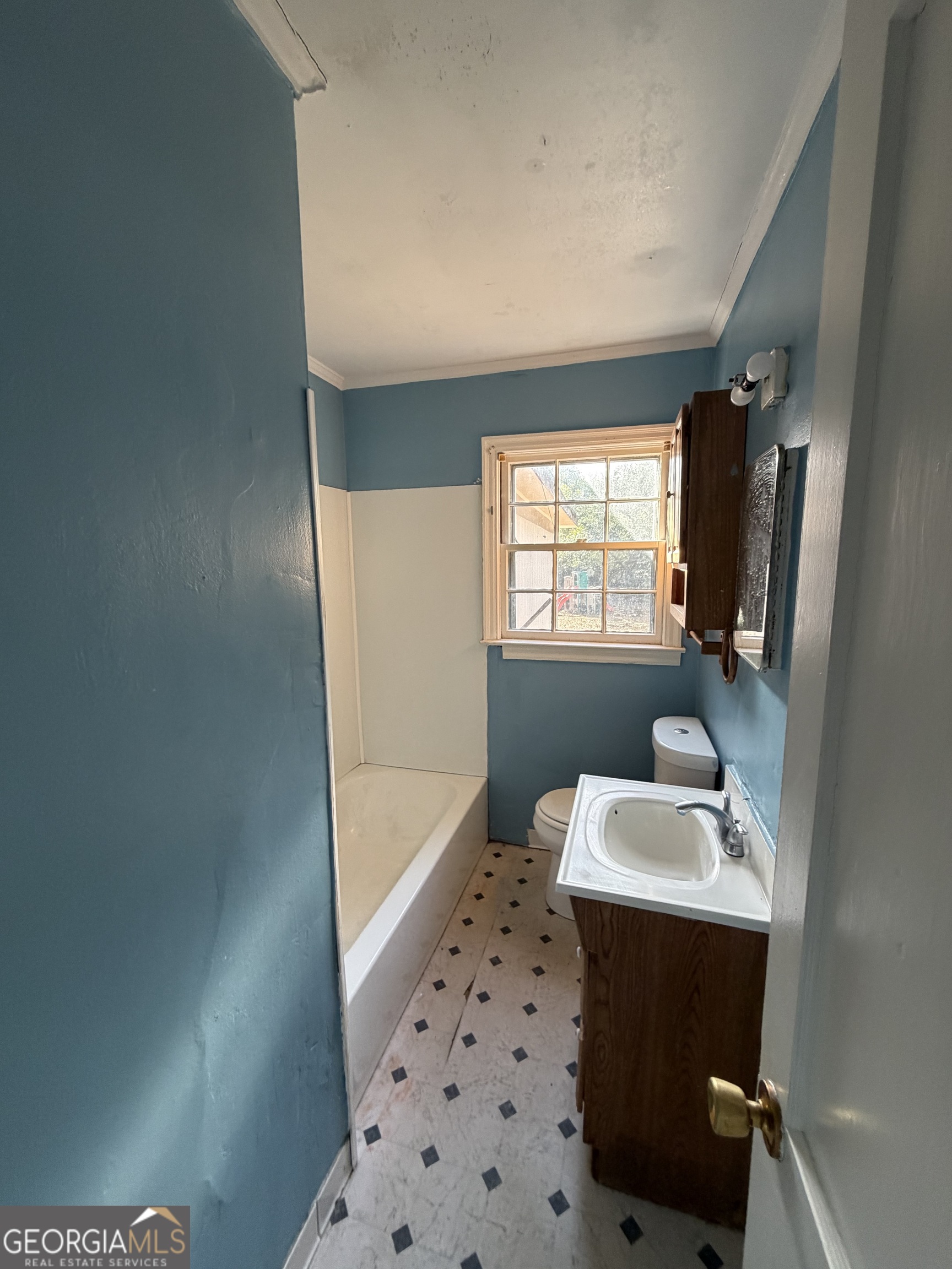 2006 Stonewall Street Dublin, GA 31021 - Photo 9 of 12 a bathroom with a sink toilet and shower