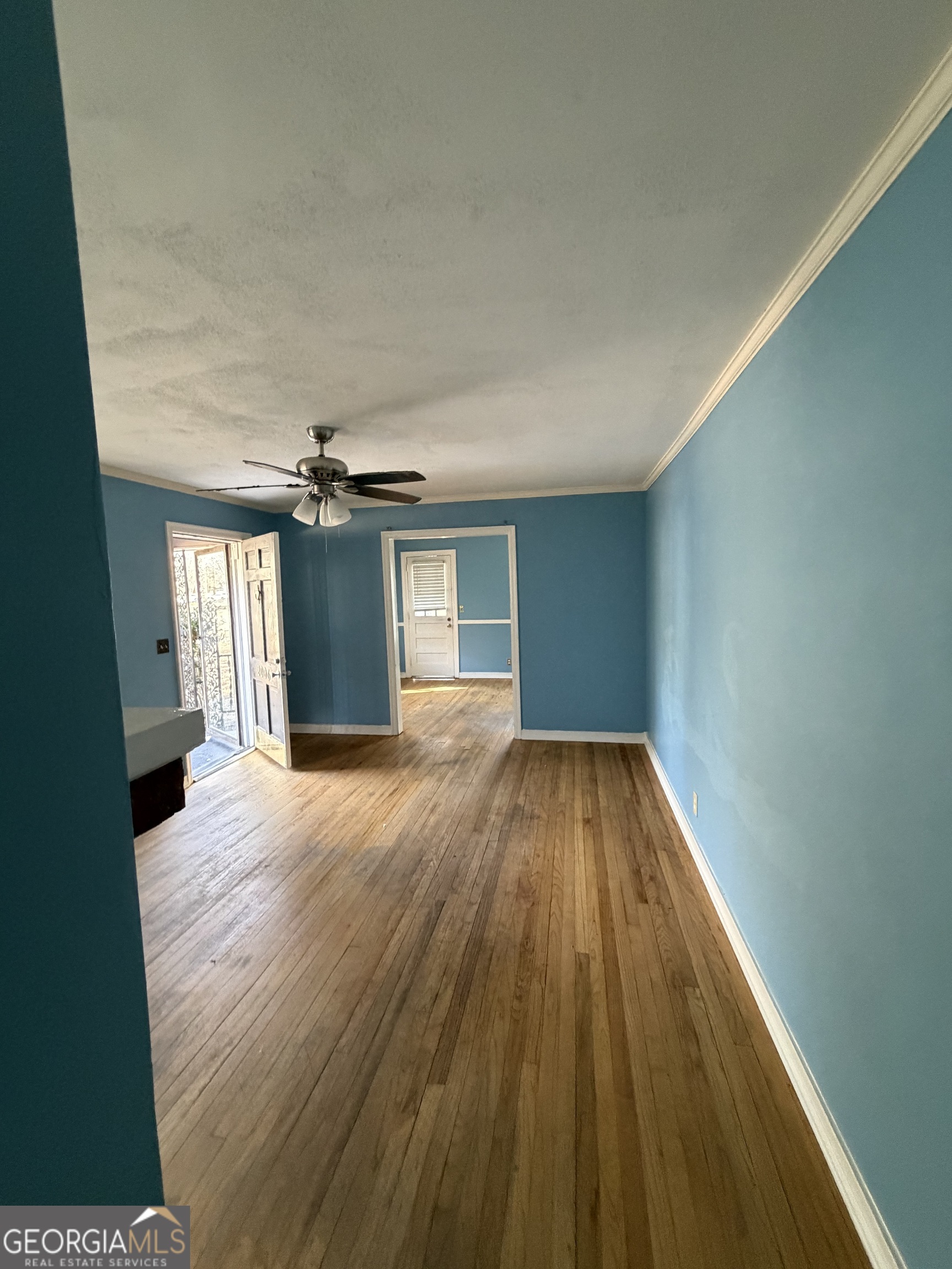2006 Stonewall Street Dublin, GA 31021 - Photo 10 of 12 wooden floor in an empty room with a window
