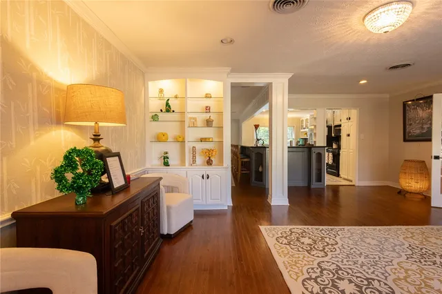 a living room with furniture and a rug