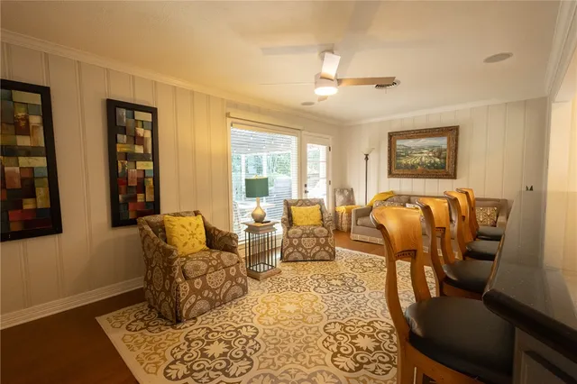 a large kitchen with a large counter top appliances and cabinets