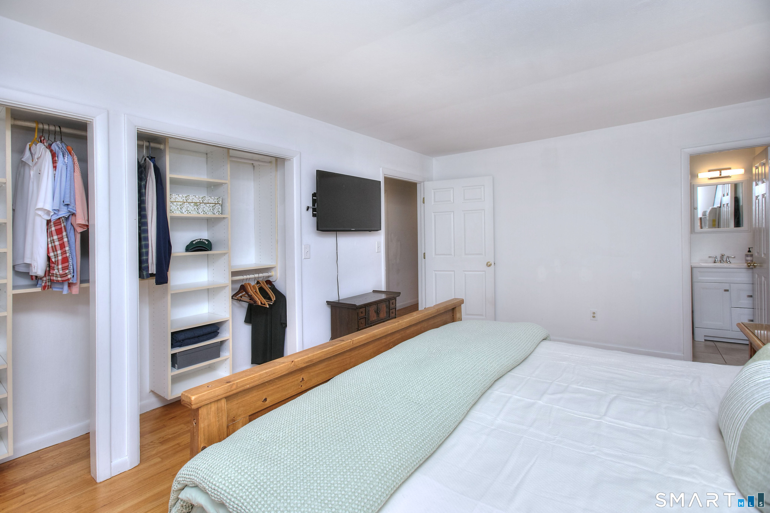 324 Ridge Road Orange, CT 06477 - Photo 27 of 38 a bedroom with a bed and furniture