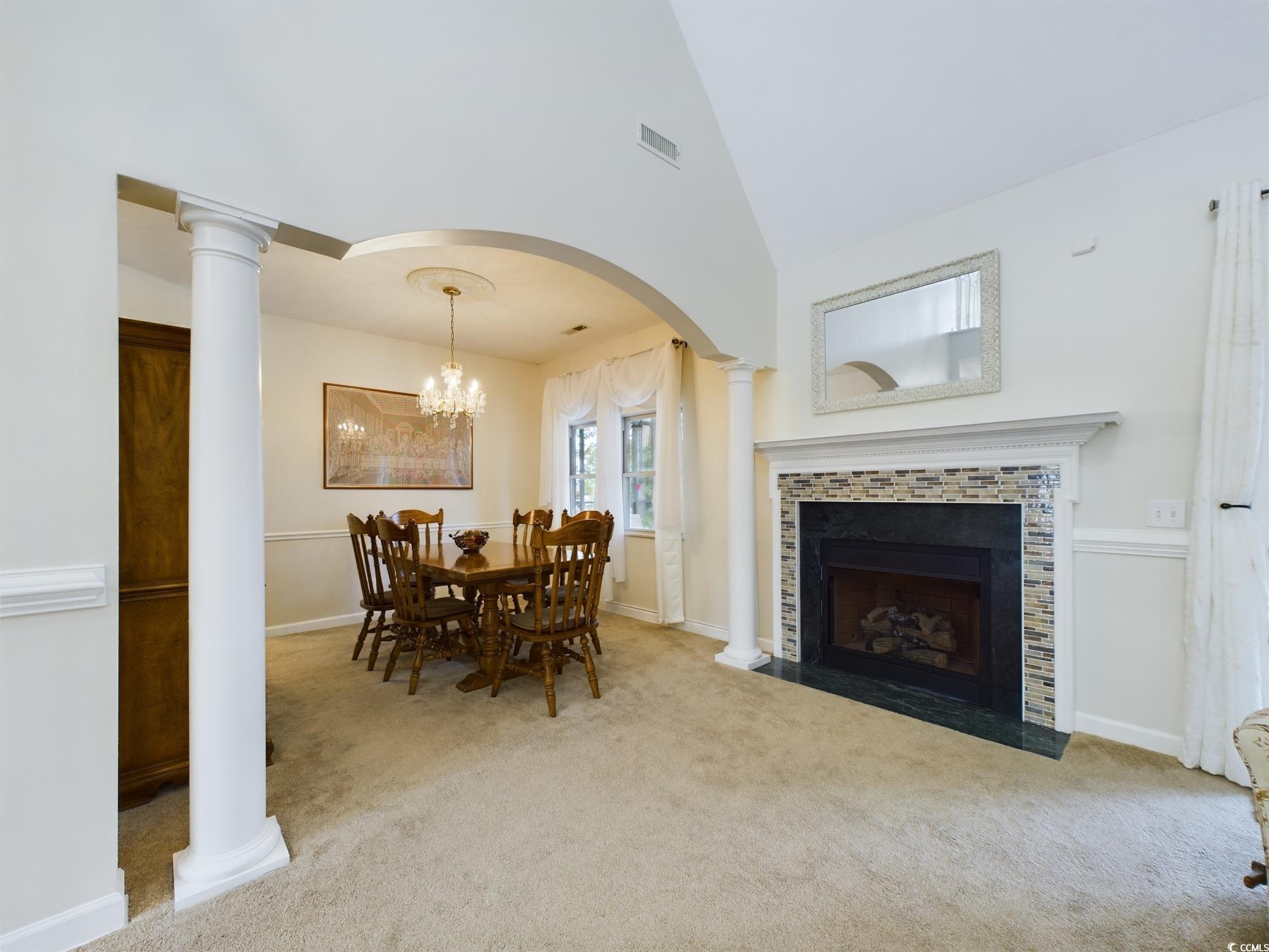 526 Saluda River Road Myrtle Beach, SC 29588 - Photo 25 of 40 Carpeted dining area with an inviting chandelier,