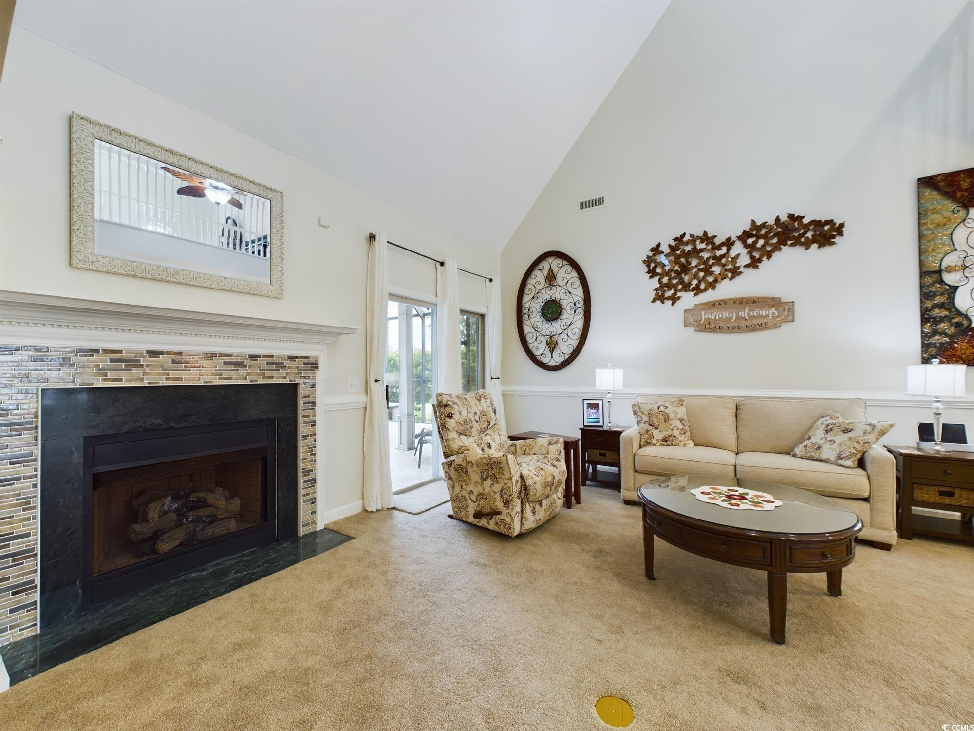 526 Saluda River Road Myrtle Beach, SC 29588 - Photo 26 of 40 Living room with carpet flooring, a tiled fireplac
