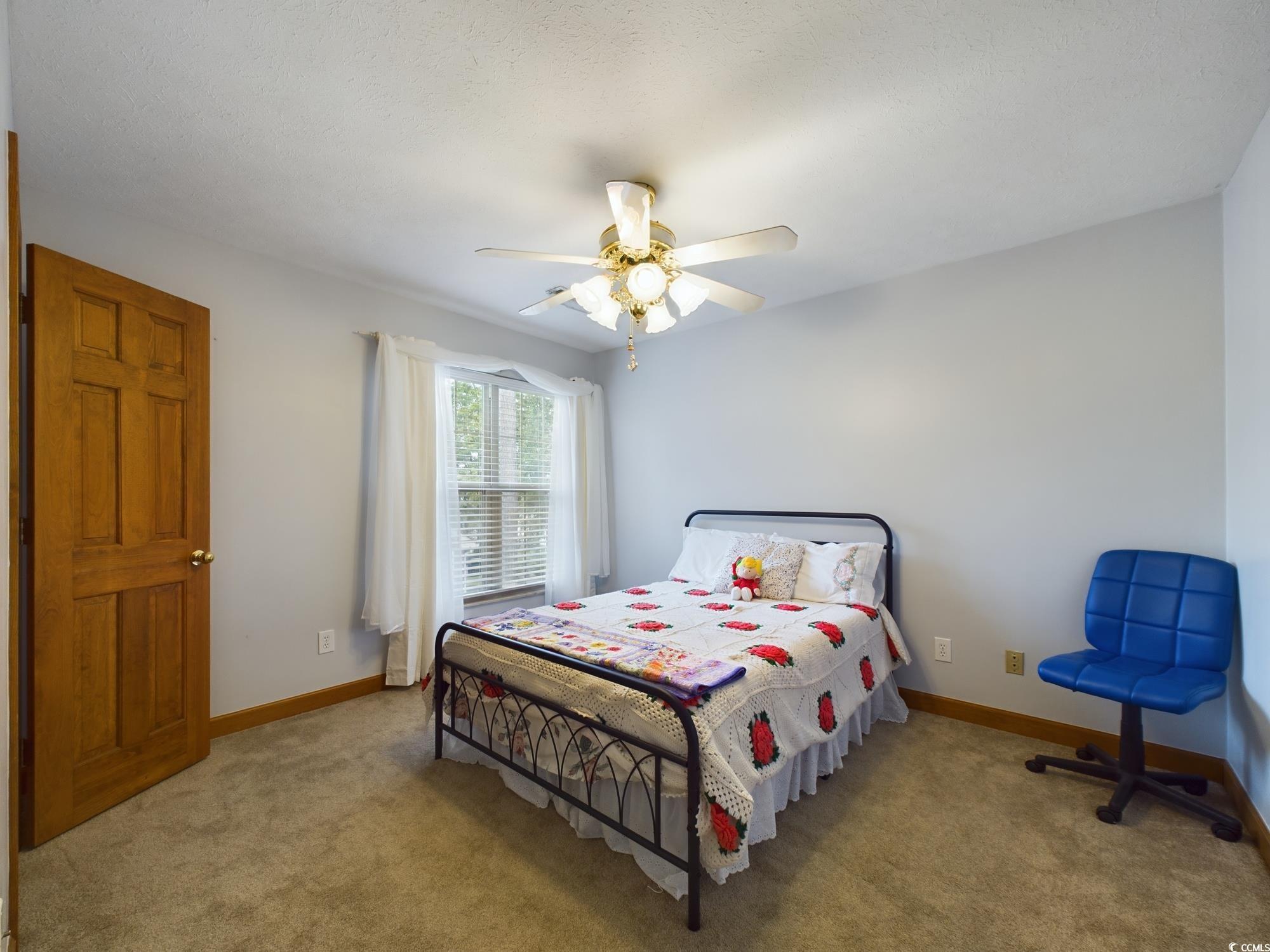 526 Saluda River Road Myrtle Beach, SC 29588 - Photo 30 of 40 Bedroom featuring light carpet and ceiling fan