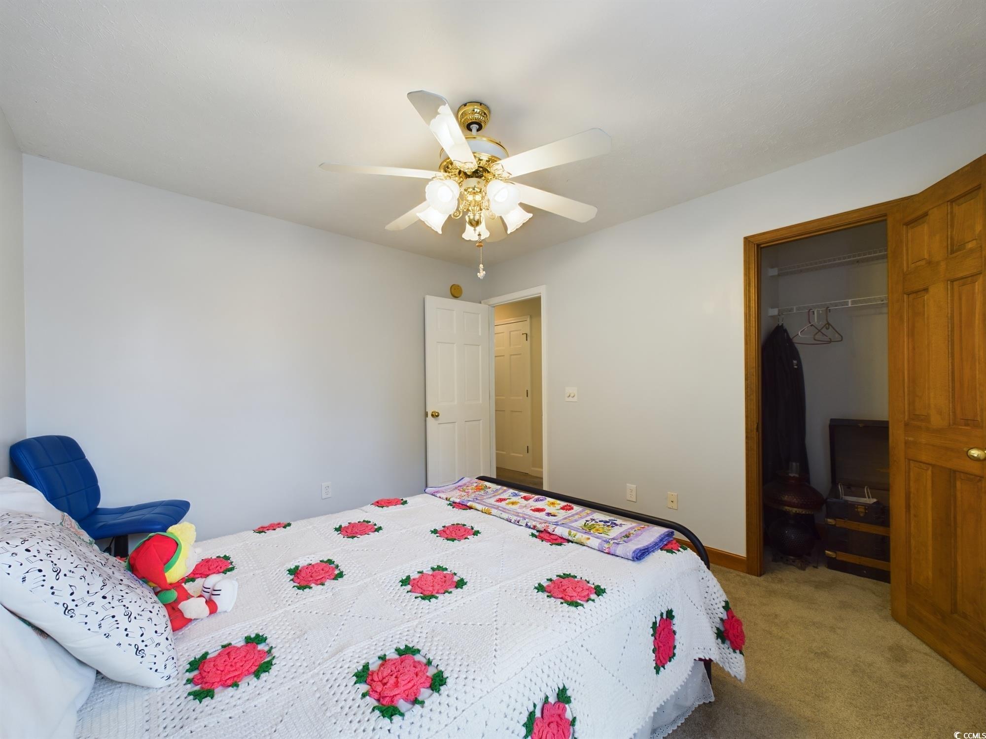 526 Saluda River Road Myrtle Beach, SC 29588 - Photo 31 of 40 Carpeted bedroom featuring ceiling fan and a close