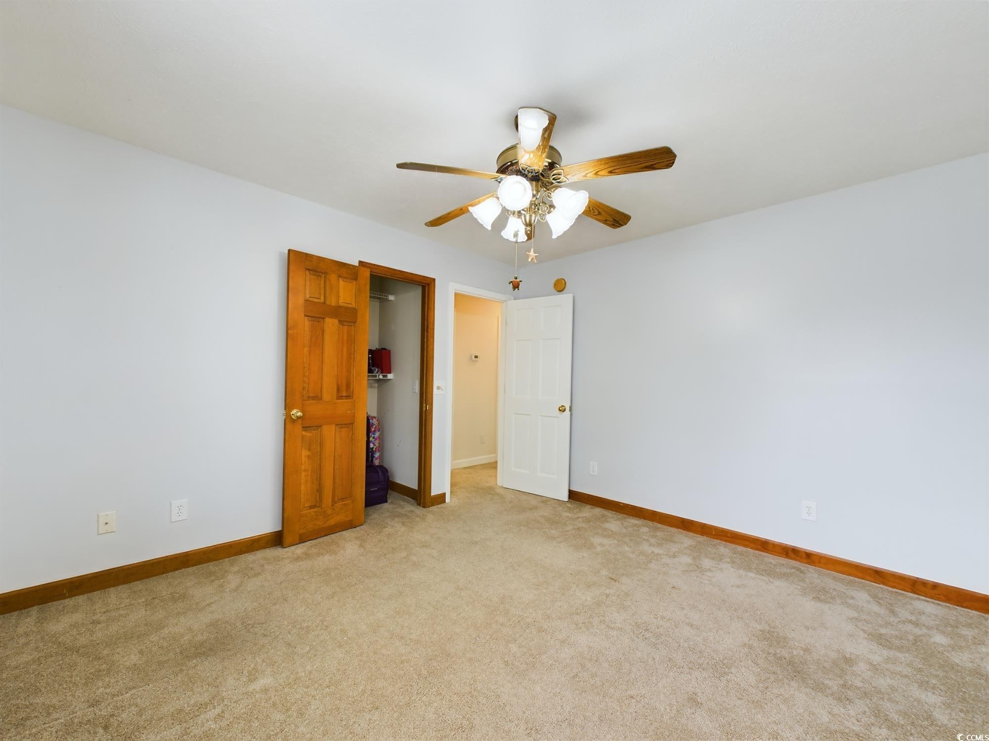 526 Saluda River Road Myrtle Beach, SC 29588 - Photo 36 of 40 Unfurnished bedroom featuring ceiling fan and ligh