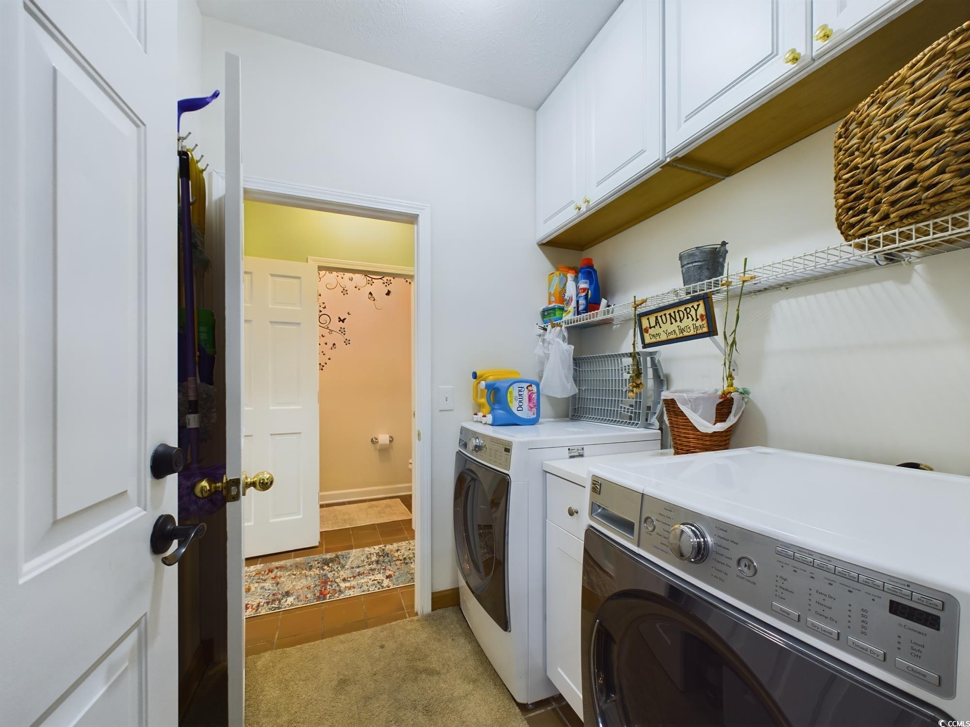 526 Saluda River Road Myrtle Beach, SC 29588 - Photo 39 of 40 Washroom with washer and clothes dryer, cabinets,