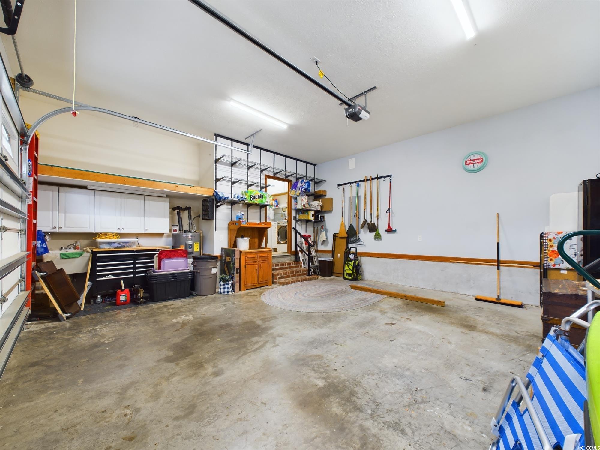 526 Saluda River Road Myrtle Beach, SC 29588 - Photo 40 of 40 Garage with a garage door opener and a workshop ar