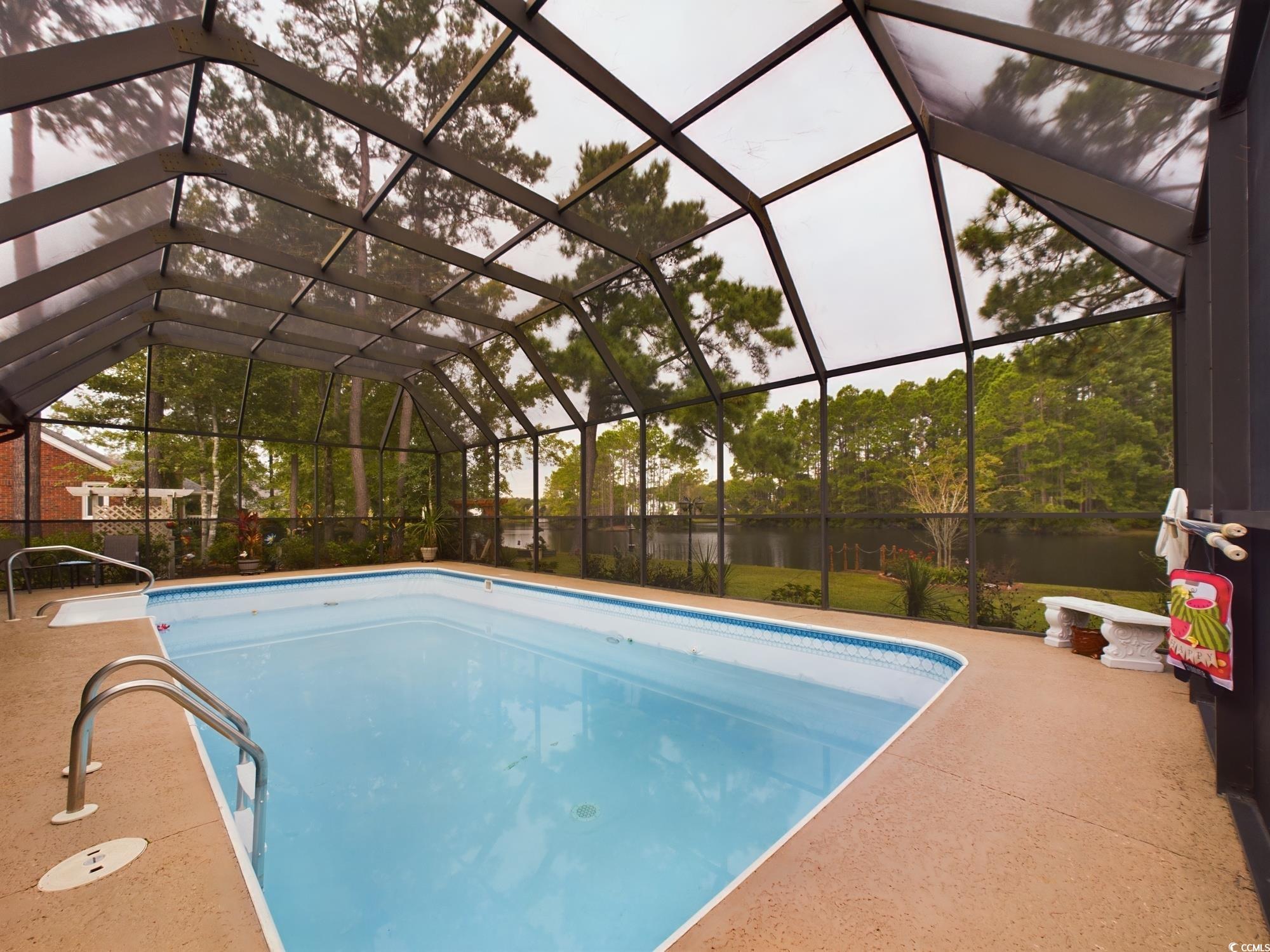 526 Saluda River Road Myrtle Beach, SC 29588 - Photo 4 of 40 View of pool featuring glass enclosure and a patio