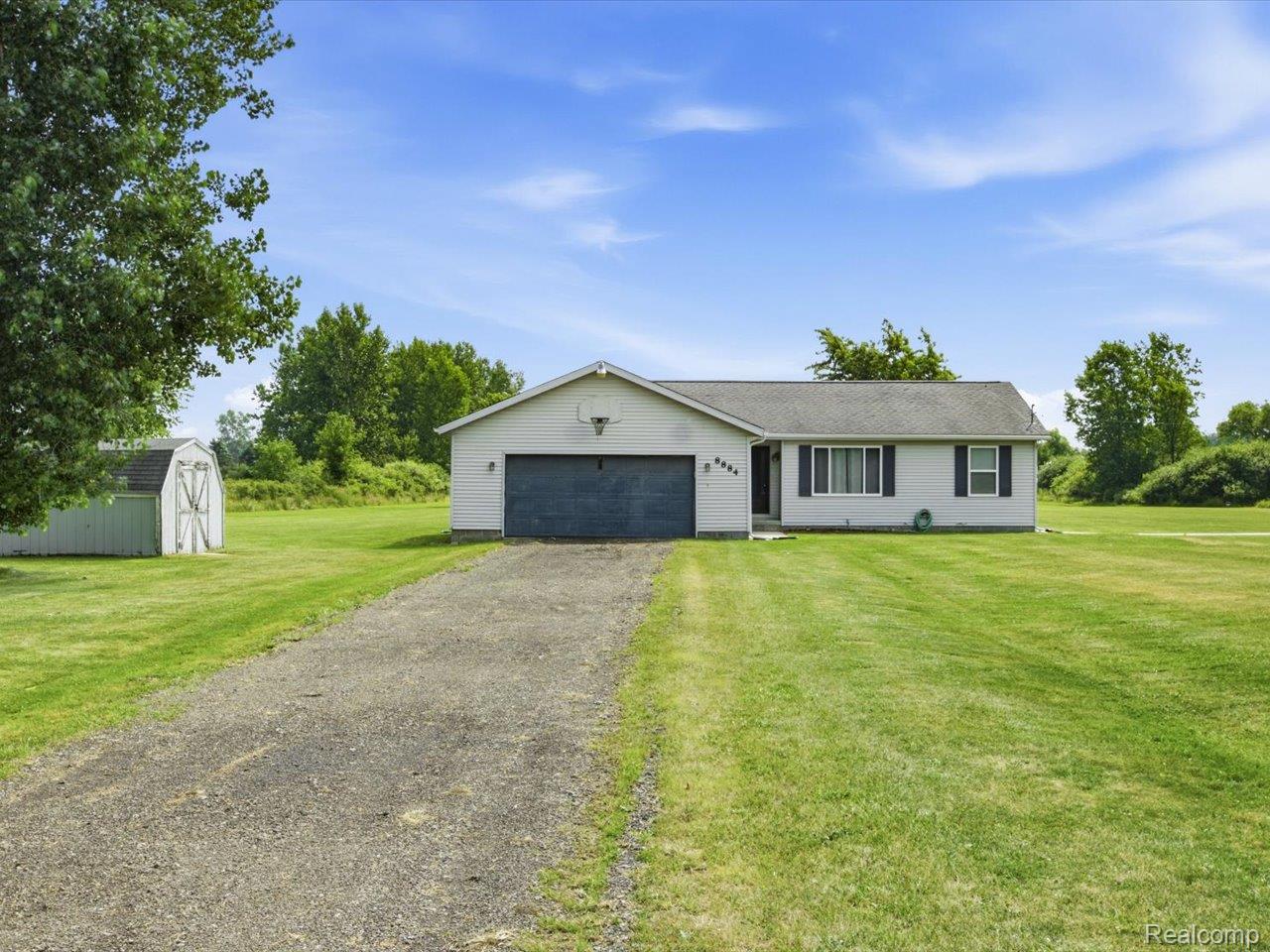 8884 Kilgore Road Avoca, MI 48006 - Photo 1 of 31 Ranch-style residence featuring a white exterior, dark shutters, and a single-car garage