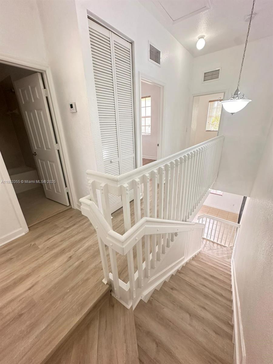 9153 Southwest 227th Street, Unit 3 Cutler Bay, FL 33190 - Photo 19 of 32 a view of entryway with wooden floor