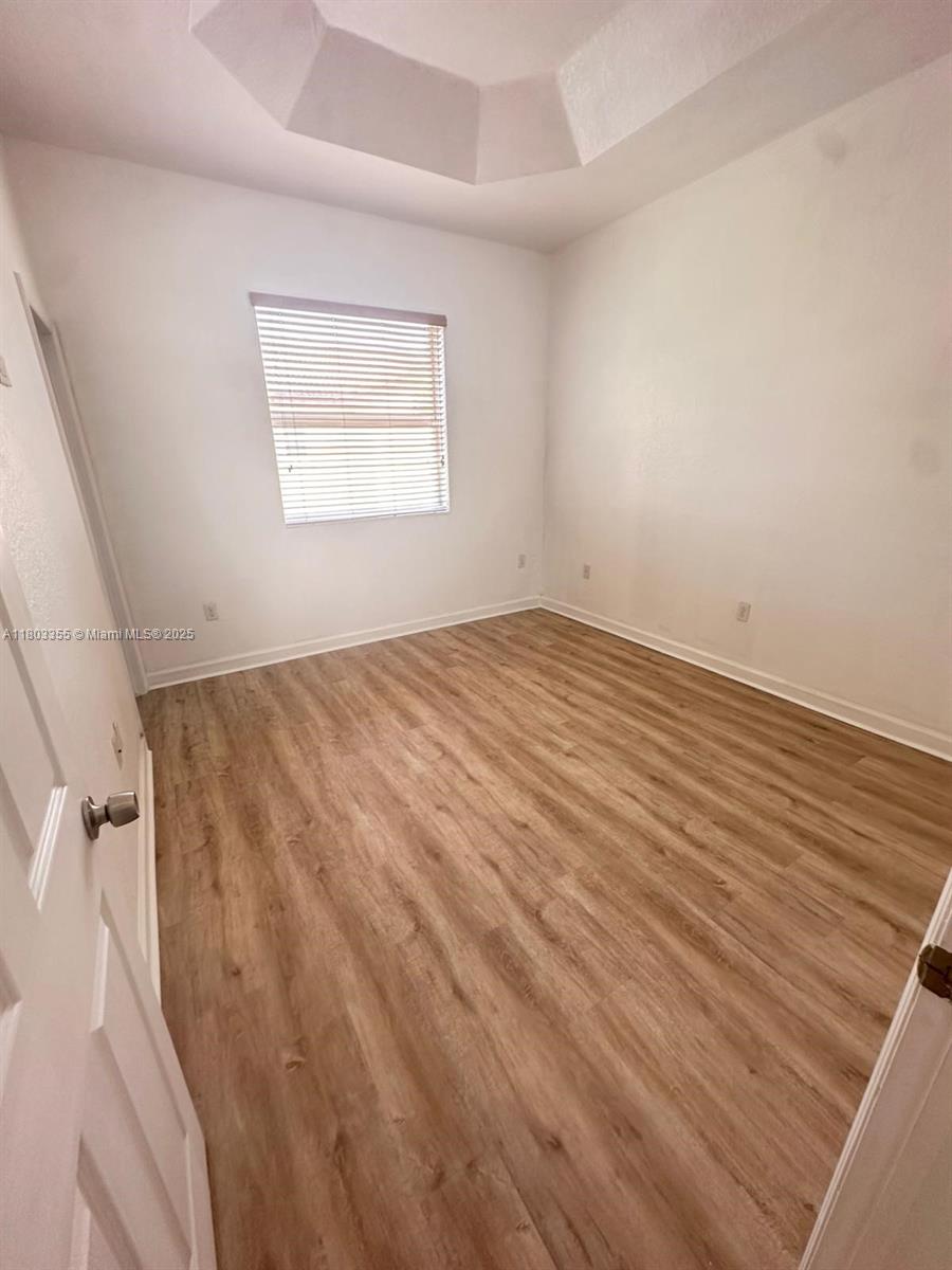 9153 Southwest 227th Street, Unit 3 Cutler Bay, FL 33190 - Photo 21 of 32 wooden floor in a room