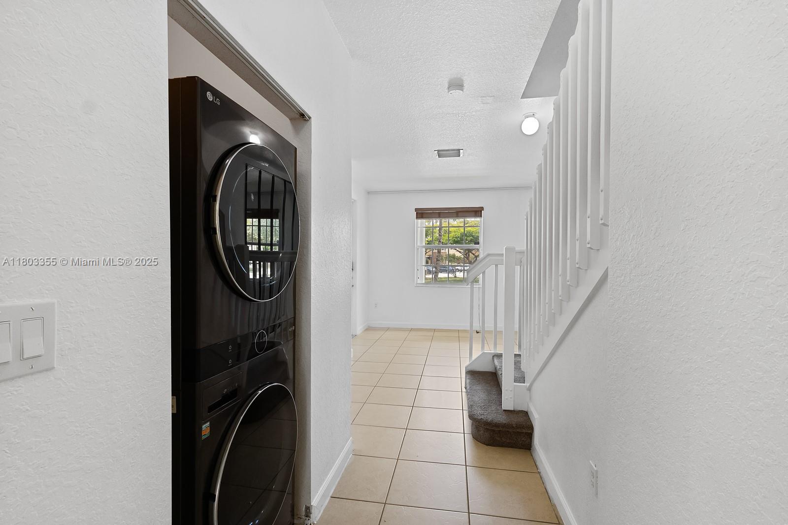 9153 Southwest 227th Street, Unit 3 Cutler Bay, FL 33190 - Photo 5 of 32 a view of entryway with washer and dryer