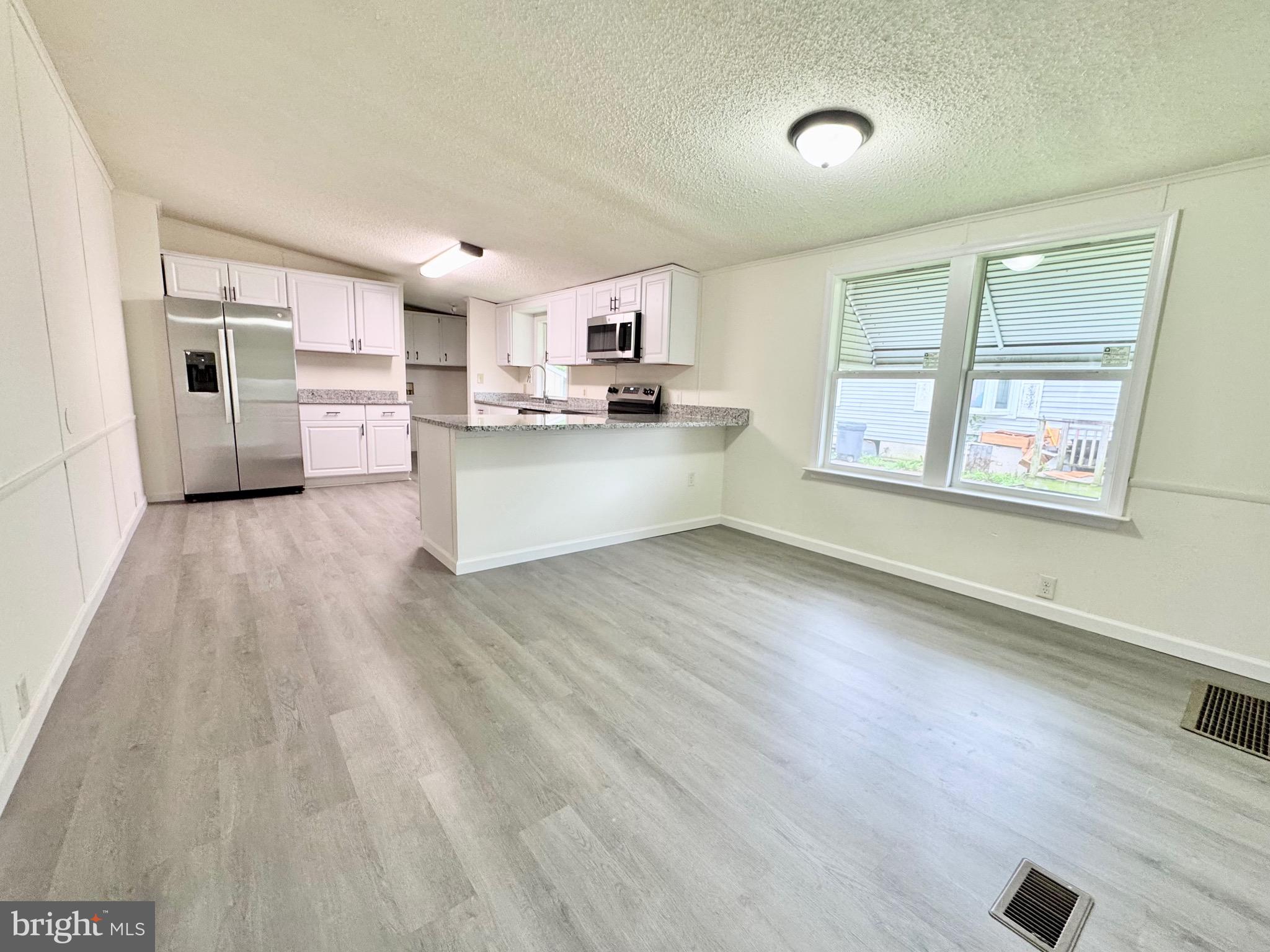 4 Welch Drive Dover, DE 19901 - Photo 11 of 22 a view of a kitchen with electric equipment