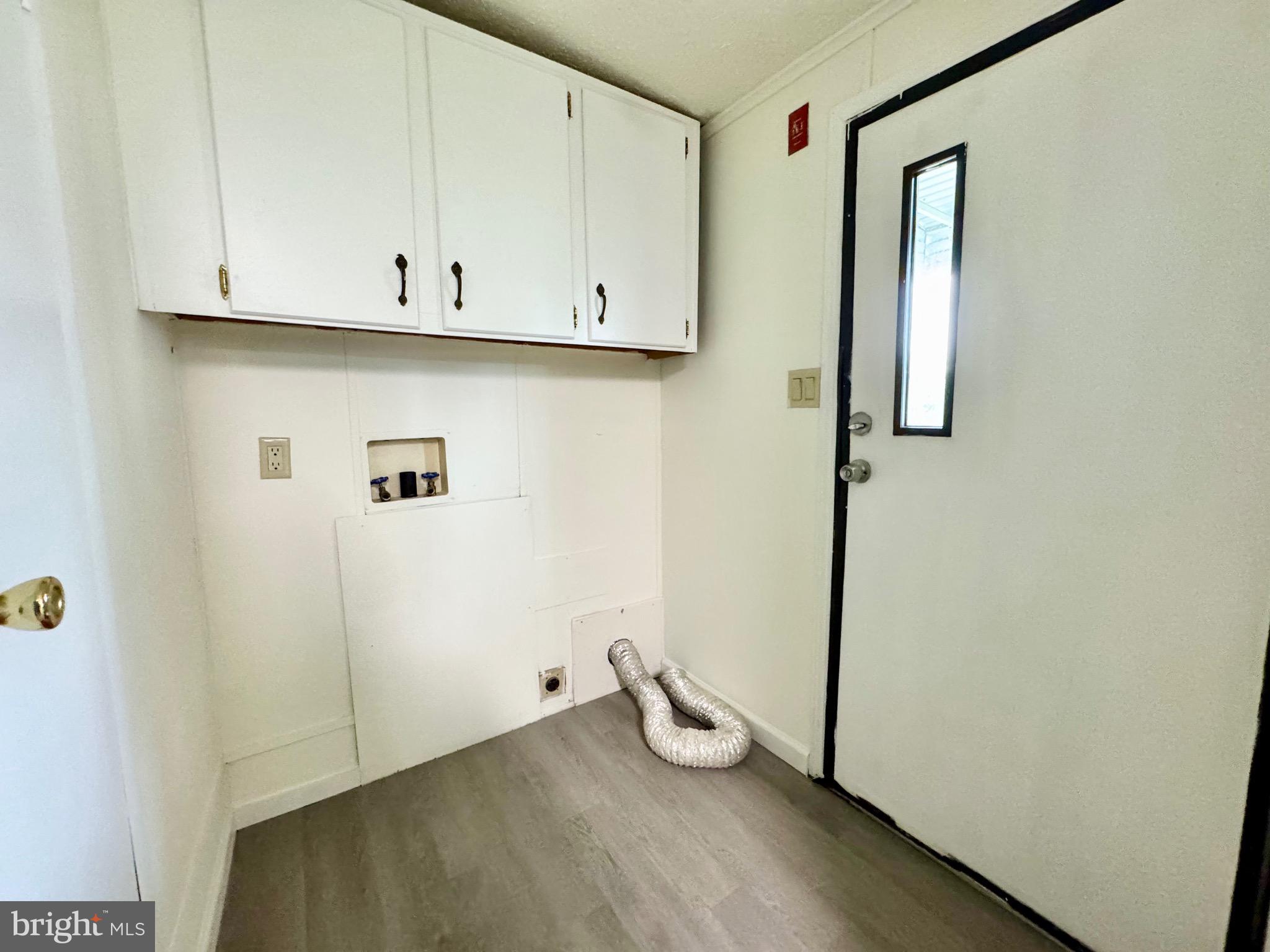 4 Welch Drive Dover, DE 19901 - Photo 17 of 22 a view of storage and utility room with wooden floor