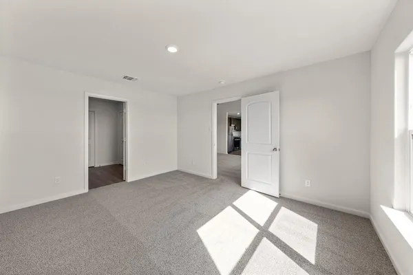 a view of an empty room and window