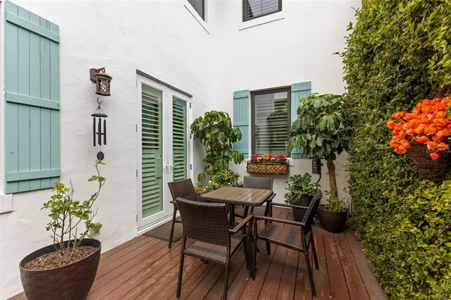 a view of a porch with furniture and a potted plant
