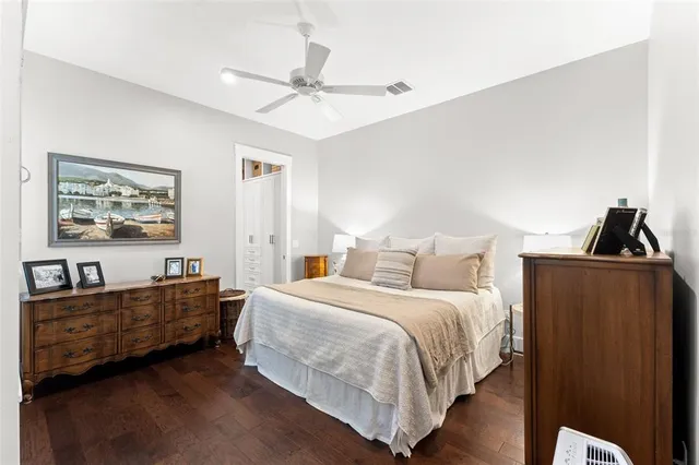 a bedroom with bed and cabinet