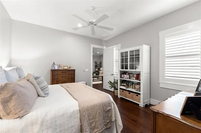 a bedroom with a bed and a bookshelf